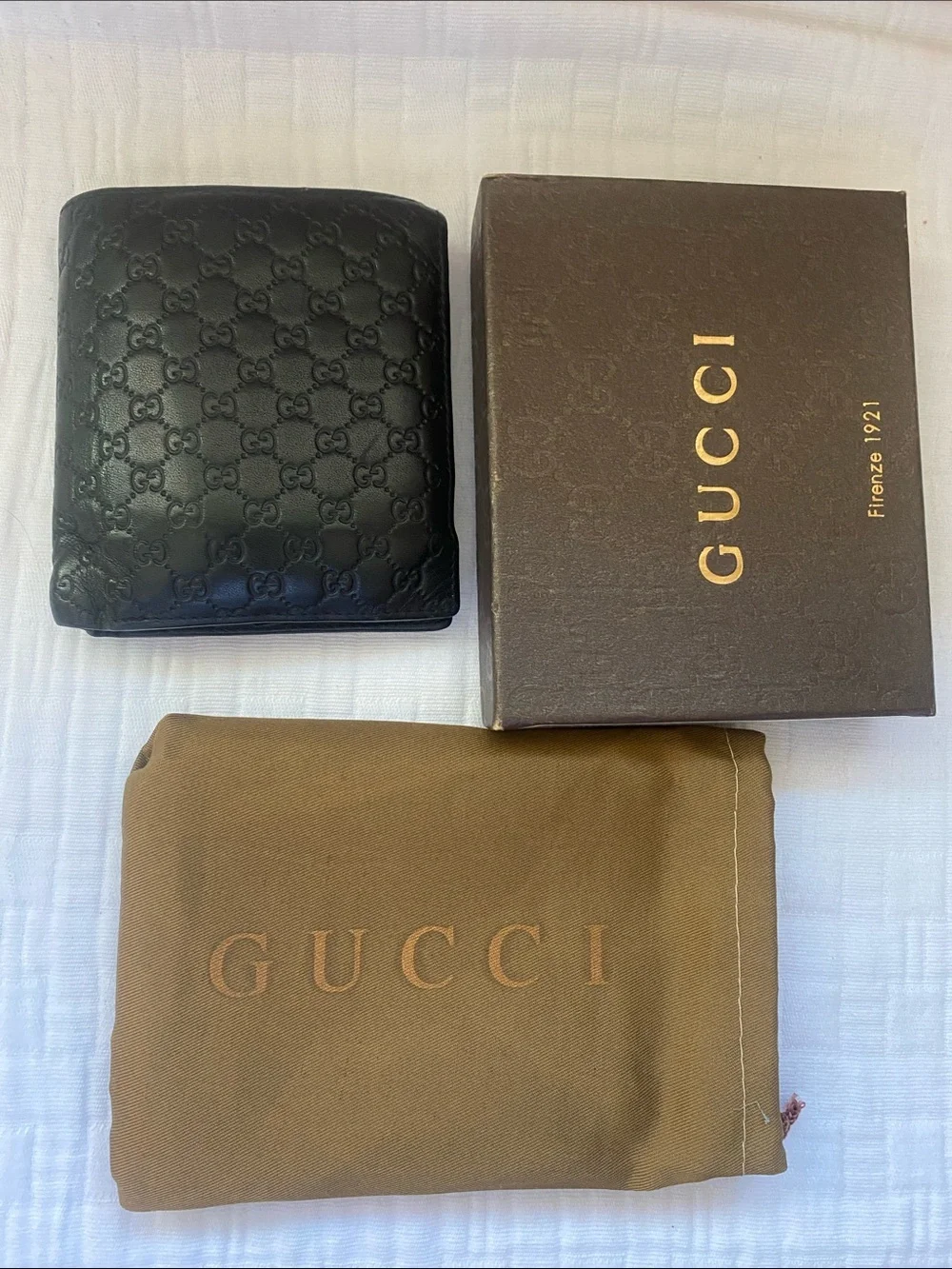 Gucci Dark Brown GG Embossed Leather Bi-Fold Wallet